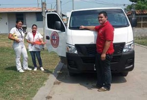 Medical student, nurse and driver prepare to visit patient